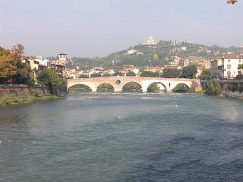 Walking on the bridge to cross into the center of Verona